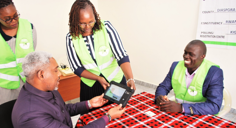 IEBC officials at hand in Rwanda conducting voter verification for Mt Kenya University staff in the diaspora on May 27, 2022