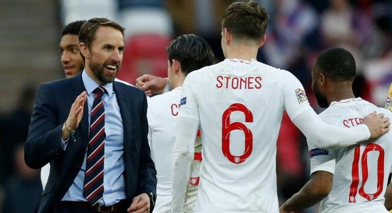 England manager Gareth Southgate congratulates his players after their dramatic win over Croatia