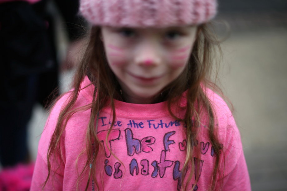 Paige Carmichael, 6, from Chadds Ford, Pennsylvania, participates in the Women's March on Washington, while wearing a pink beanie and a homemade shirt that reads, "The future is nasty!"