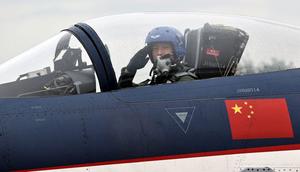 A pilot in a J-10 fighter jet of the Bayi Aerobatics Team of the People's Liberation Army Air Force (PLAAF) salutes during the 2022 Changchun Air Show at Changchun Dafangshen Airport on August 29, 2022 in Changchun, Jilin Province of China.Zhou Guoqiang/VCG/Getty Images