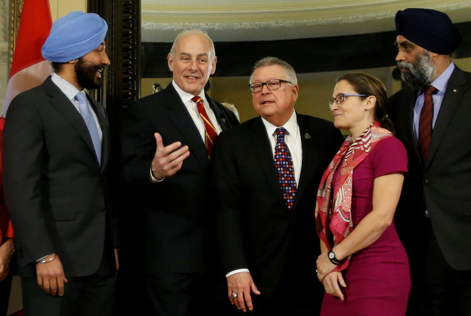 US Homeland Security chief John Kelly, second left, with Canada's Innovation, Science and Economic Development Minister Navdeep Bains, left, Public Safety Minister Ralph Goodale, center, Foreign Minister Chrystia Freeland, second right, and Defense Minister Harjit Sajjan in Ottawa, March 10, 2017.