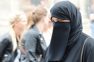 An Islamic woman going shopping in Vienna