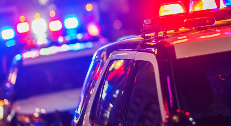 A stock photo of police vehicles with flashing lights.Getty Images