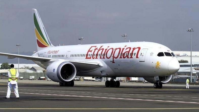 A member of the ground crew directs an Ethiopian Airlines plane at the Bole International Airport in Ethiopia's capital Addis Ababa, August 21, 2015.   REUTERS/Tiksa Negeri