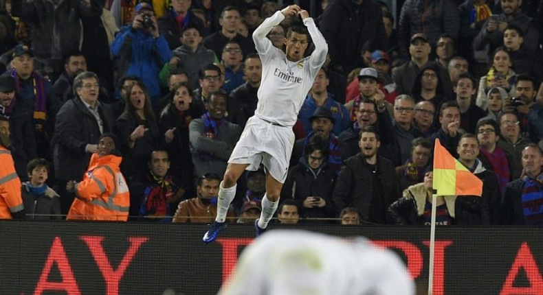 Real Madrid's forward Cristiano Ronaldo celebrates after scoring a goal against in Barcelona on April 2, 2016