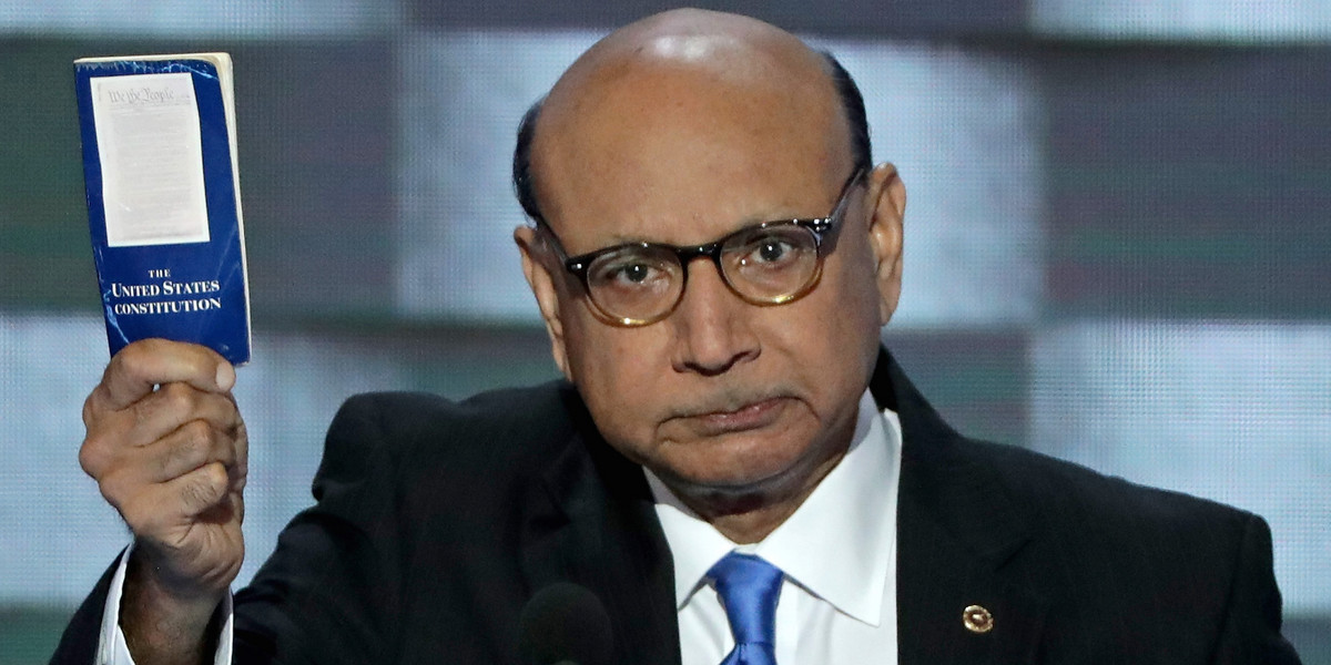 Khizr Khan, father of a deceased Muslim US Soldier, holds up a booklet of the US Constitution as he delivers remarks on the fourth day of the Democratic National Convention at the Wells Fargo Center in Philadelphia.