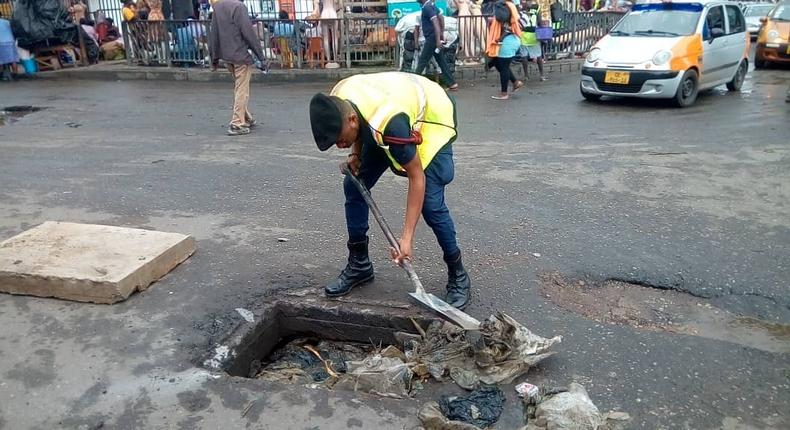 Lance Corporal Simon Agbeko desilts choked drains in Accra