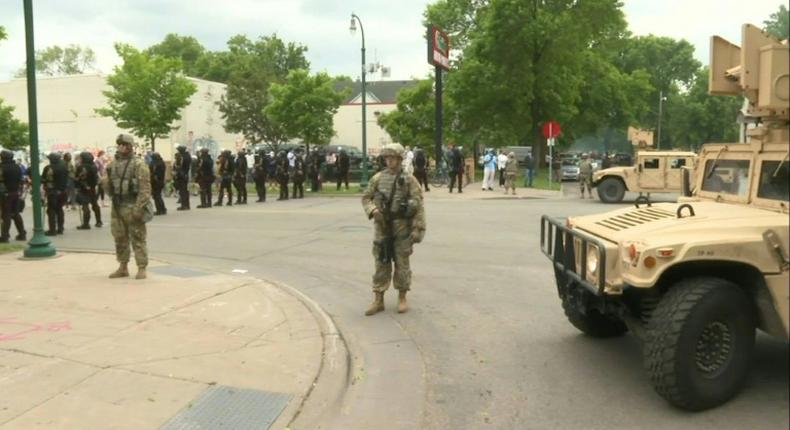 IMAGES National Guard soldiers are deployed in Minneapolis for peacekeeping after a third night of rioting over police brutality against African Americans left hundreds of shops damaged and a police station on fire.