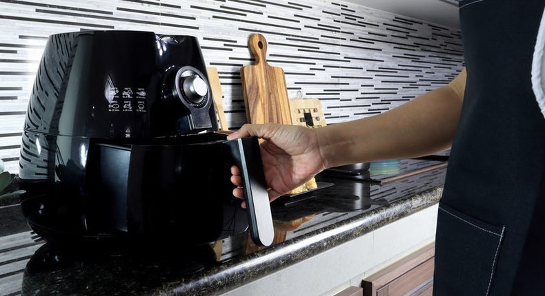 Regularly cleaning your air fryer will help prevent any lingering smells.Enjoy The Life/Shutterstock