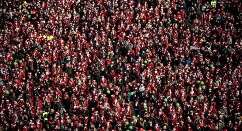 The Italian charity event Papa Noel in Turin, Italy, drew a record 20,000 Santas in red costumes and long white beards