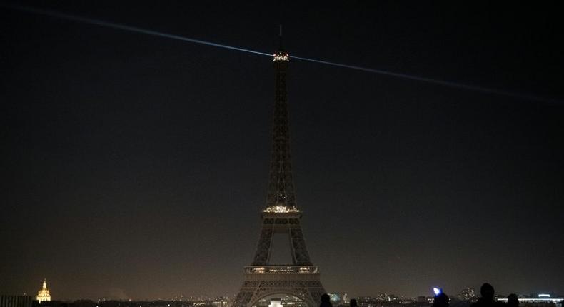 The lights of the Eiffel Tower are exceptionally switched off in Paris, on December 14, 2016, in support of the Syrian city of Aleppo