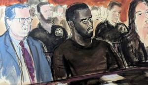 In this courtroom sketch, Sean Combs, center, sits alongside his defense attorneys in Manhattan federal court.Elizabeth Williams via AP