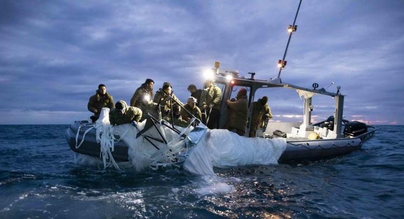 Sailors assigned to Explosive Ordnance Disposal Group 2 recover a high-altitude surveillance balloon off the coast of Myrtle Beach, South Carolina, Feb. 5, 2023.Petty Officer 1st Class Tyler Thompson