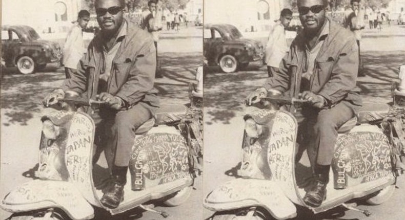 Ajala the traveller on his Vespa 