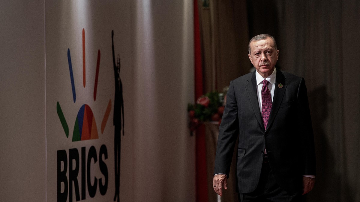 Turkey's President Tayyip Erdogan arrives for a group picture at the BRICS summit meeting in Johannesburg