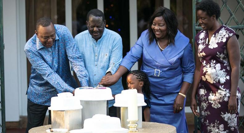 File image of President Uhuru Kenyatta with Raila Odinga’s family