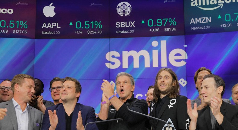 David Katzman, CEO of SmileDirectClub stands with founders Jordan Katzman and Alex Fenkell as the company debuts its IPO at the Nasdaq MarketSite in New York, U.S. September 12, 2019. REUTERS/Lucas Jackson