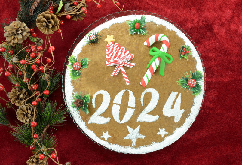 2024,New,Year's,Cake,And,Artificial,Christmas,Decorations,On,Red