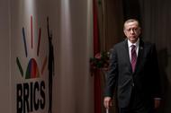 Turkey's President Tayyip Erdogan arrives for a group picture at the BRICS summit meeting in Johannesburg