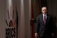 Turkey's President Tayyip Erdogan arrives for a group picture at the BRICS summit meeting in Johannesburg