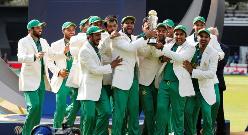 Pakistan's Sarfraz Ahmed (3rdR) lifts the trophy as Pakistan players celebrate their win at the ICC Champions Trophy on June 18, 2017