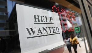 A help wanted sign hangs on a window of a restaurant on June 1, 2018 in Miami, Florida.Joe Raedle/Getty Images