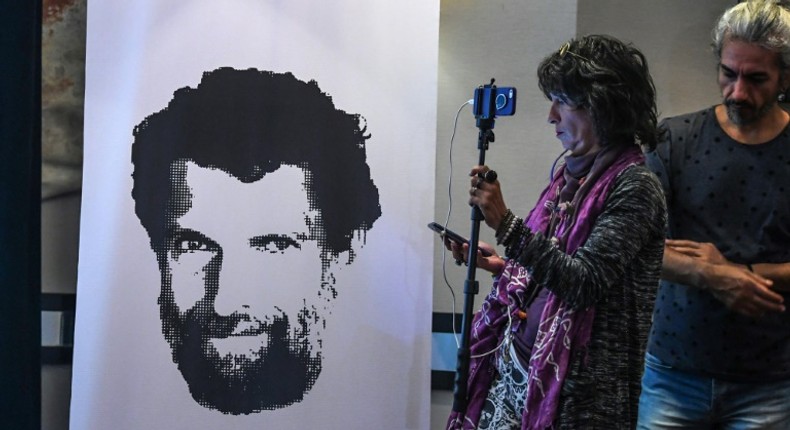 Osman Kavala, depicted in a poster at a news conference of his lawyers in October, is one of 16 people accused of orchestrating the Gezi Park protests of 2013 -- charges dubbed an absurd sham by critics