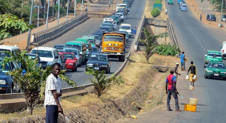 Petrol black market sellers await buyers in Ogun State.