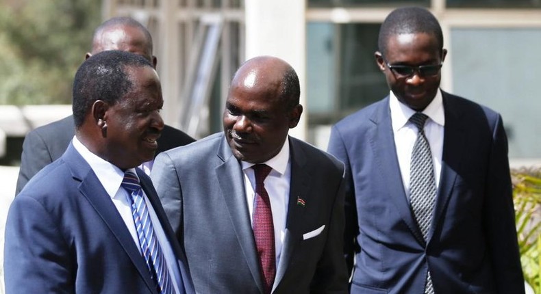 NASA luminary Raila Odinga with IEBC Chairman Wafula Chebukati (C) and CEO Ezra Chiloba during their meeting at the Capital Hill on February 8, 2017.