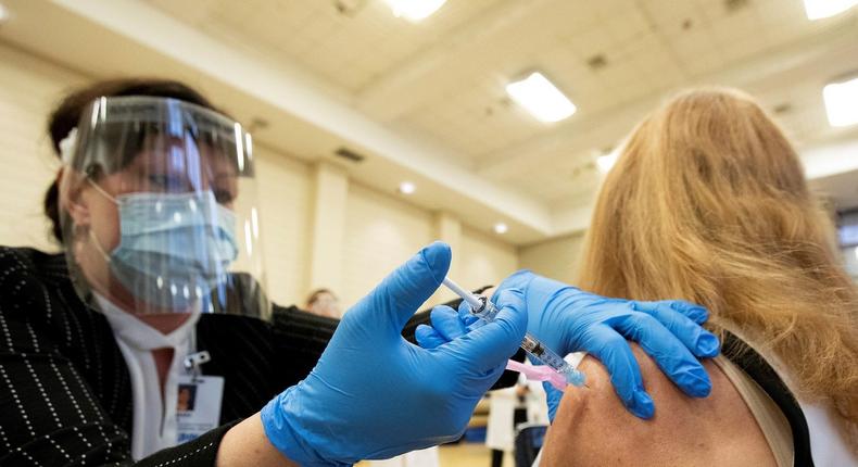 A nurse is inoculated with the Pfizer/BioNTEch coronavirus vaccine in Toronto, Canada, December 14, 2020.
