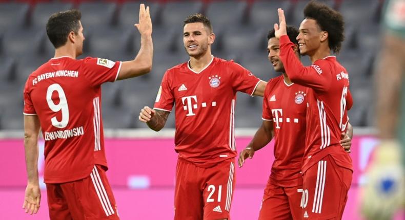 Bayern Munich players celebrate after scoring in their 8-0 rout of Schalke in their Bundesliga season opener