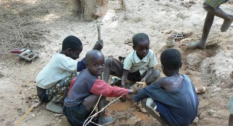 Some children practising illegal mining