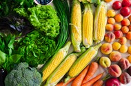 flat lay of different summer fruits, vegetables, greens and berries