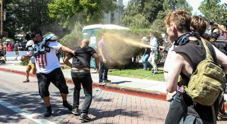 Joey Gibson (black t-shirt), leader of the alt-right Patriot Prayer group, gets pepper sprayed by leftist counter demonstrators in Berkeley, California