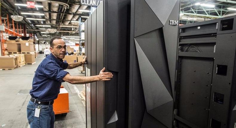 A worker guides the first shipment of an IBM System Z mainframe computer in Poughkeepsie