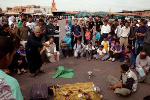 Arab Storyteller and crowd, Djemma el Fna Square Marrakech Morocco Africa