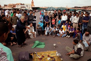 Arab Storyteller and crowd, Djemma el Fna Square Marrakech Morocco Africa