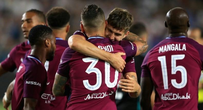 Manchester City's John Stones congratulates teammate Nicolas Otamendi after scoring a goal during their International Champions Cup match against Real Madrid, at Los Angeles Memorial Coliseum, on July 26, 2017