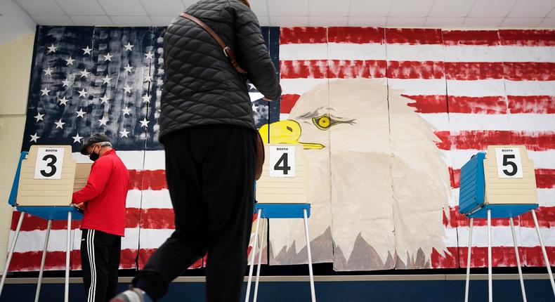 Voters cast their ballots near a giant mural at Robious Elementary School in Midlothian, Va., on October 3, 2020. Midlothian is located in Chesterfield County, a longtime Republican stronghold where Democrats have made big gains in recent years.