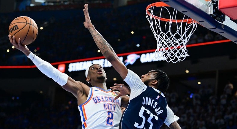 Shai Gilgeous-Alexander of the Oklahoma City Thunder shoots the ball against Derrick Jones Jr. #55 of the Dallas Mavericks during the 2024 Western Conference semifinals.Joshua Gateley/Getty Images