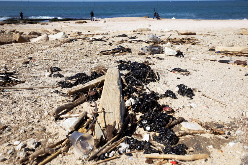 Israel's beaches blackened by tar after offshore oil spill