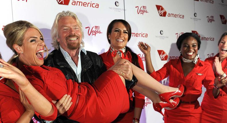 Virgin Group and Virgin America founder Sir Richard Branson with the airline's flight attendants.