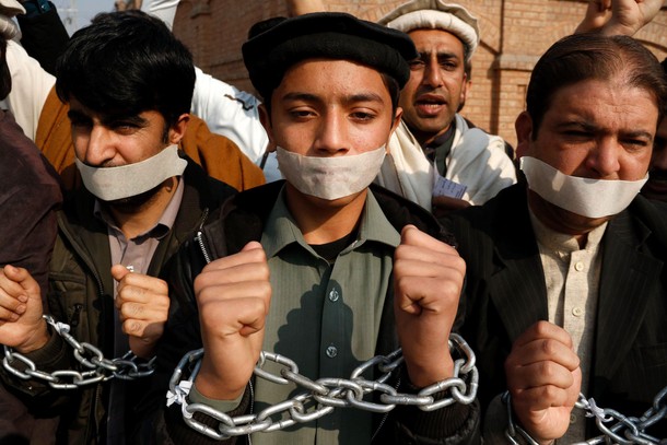 Civil society members take part in protest against the attack on Bacha Khan University at a demonstr