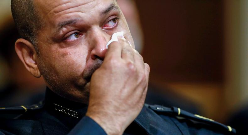 US Capitol Police Sgt. Aquilino Gonell wipes his eye as he watches a video being displayed during a House select committee hearing on the Jan. 6 attack on Capitol Hill in Washington, Tuesday, July 27, 2021.