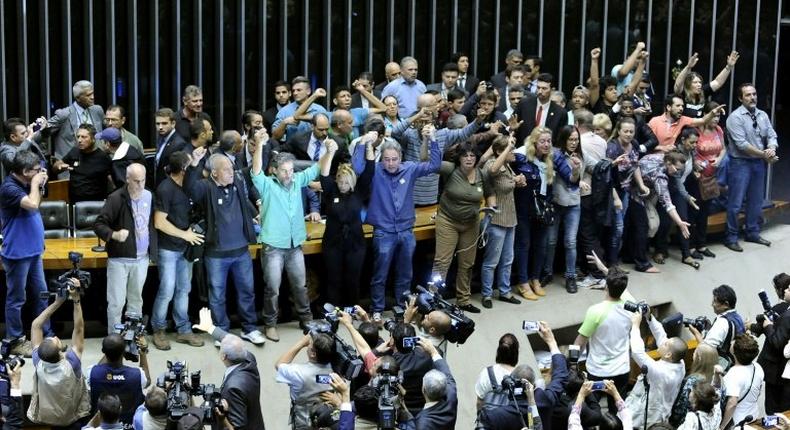 Demonstrators in favor of a military intervention in Brazil invade the legislative chamber on November 16, 2016