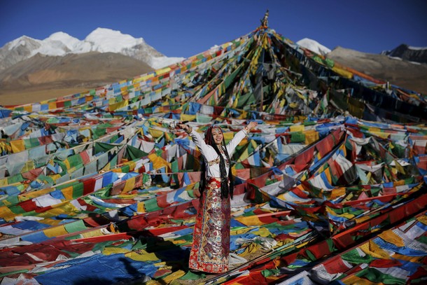 Jing Li wears Tibetan traditional costume as she gets ready for her wedding photo to be taken at the