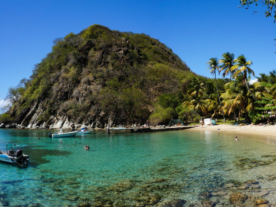 Named after Sugarloaf Beach in Rio de Janeiro, Brazil, Pain de Sucre is often considered one of the best hidden gems in Terre-de-Haut, an island in Guadeloupe. Though the beach takes a 15-minute rocky walk to arrive to, it offers prime snorkeling. Explore its clear waters to see everything from trumpetfish to stunning colorful coral.