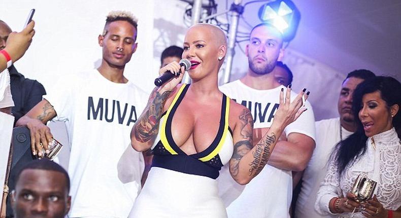 Amber Rose spills boobs on the Caribbean Island of Curacao