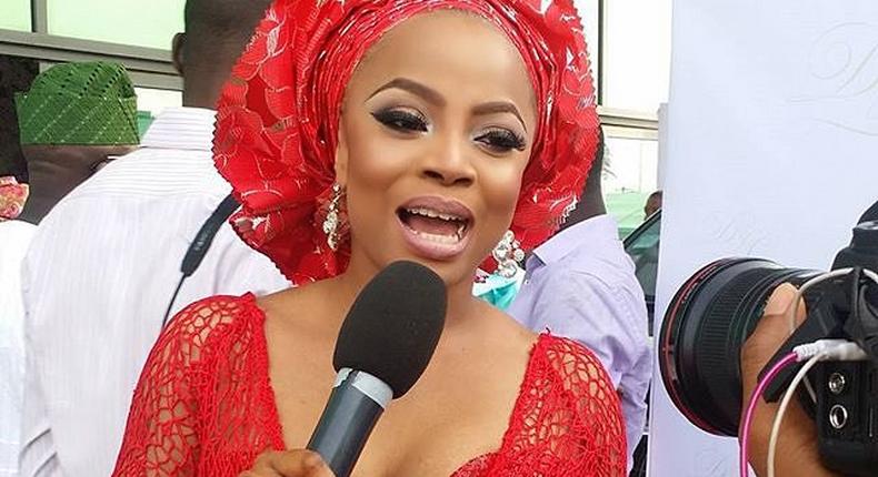 Toke Makinwa looking stunning in her red Aso Ebi