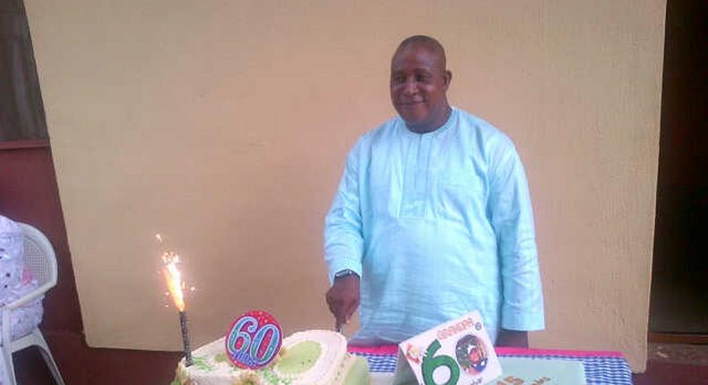 Adebayo Salami aka Oga Bello cutting his 60thbirthday cake in 2013